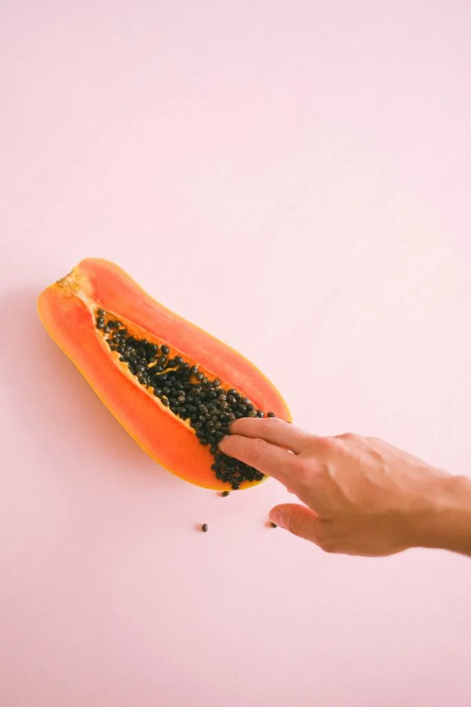 Papaya with Seeds representing Vagina, Man Fingering for Sexual Pleasure